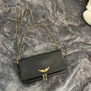 zadig and voltaire rock clutch bag in black and gold